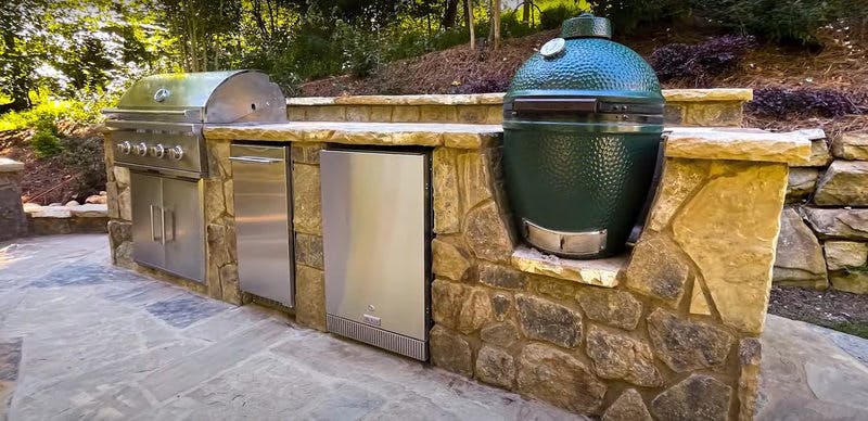 Outdoor kitchen with a grill.