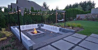Patio with a fire pit and seating area.